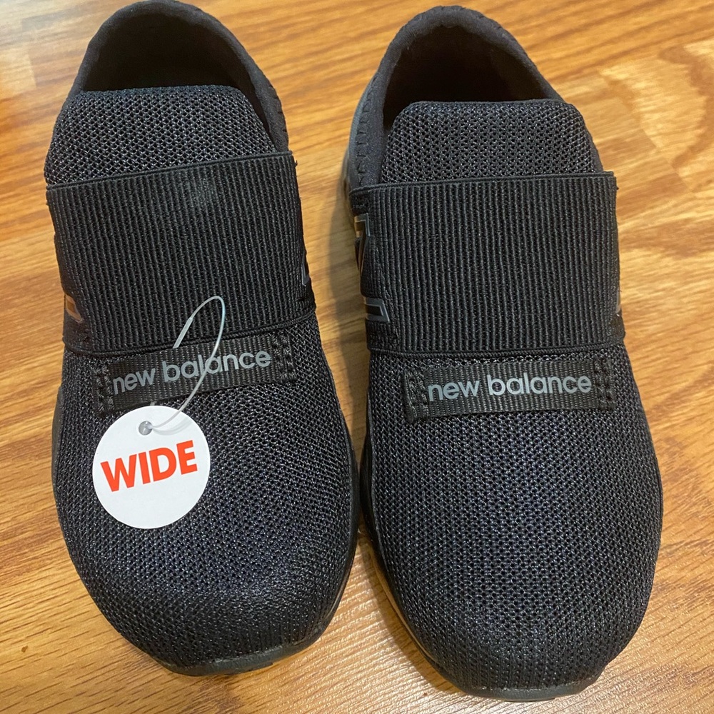 Black New Balance toddler sneakers. Wide width.
